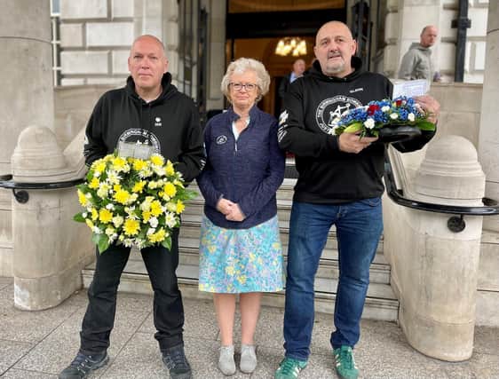 Julie Hambleton (centre), whose sister Maxine was killed in the Birmingham pub bombs, outside Belfast City Hall on Saturday with supporters of the families' campaign for justice Ian Williams from Preston (left) and Glenn Randall from London (right) who completed a walk from Birmingham to Belfast to raise awareness and also funds to support a potential legal challenge against the bill. Photo: David Young/PA Wire