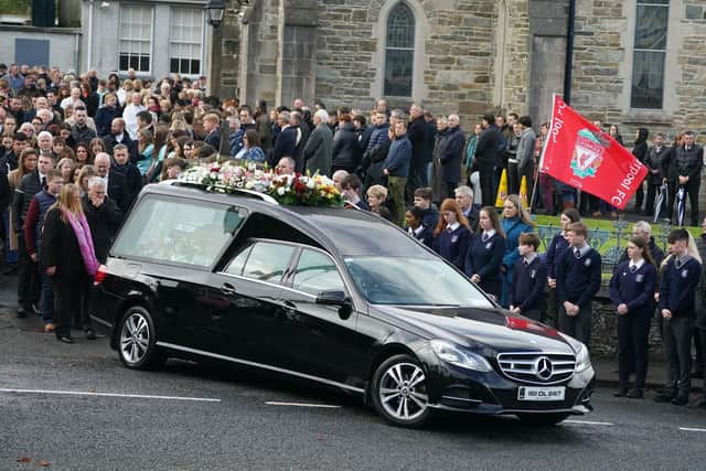 Leona Harper's parents Donna and Hugh follow behind the hearse as it leaves St Mary's Church in Ramelton, Co Donegal, after her funeral mass.