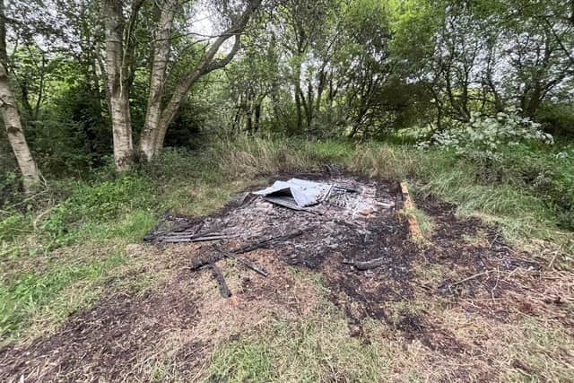 The scene of a deliberate fire that burned down a shed housing essential equipment for a comprehensive study of wildlife in the Killycolpy area of Lough Neagh