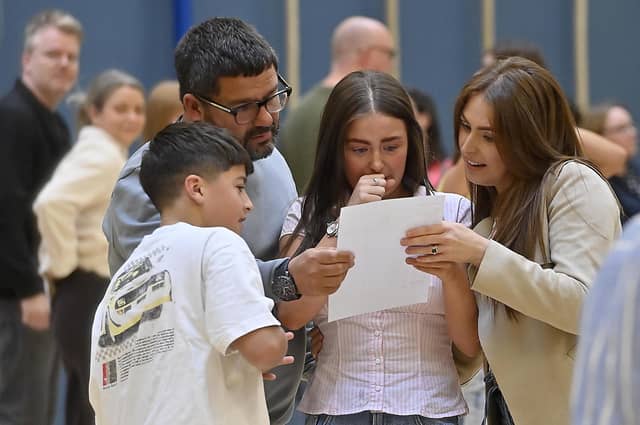 Pupils at Grosvenor Grammar school in Belfast pictured receiving their GCSE exam grades.