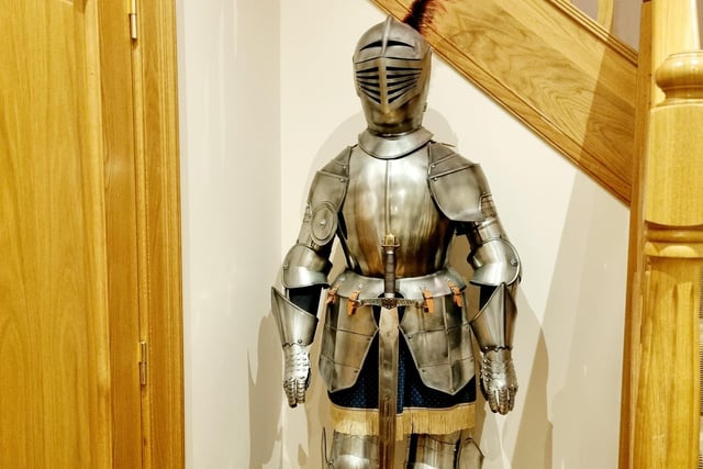 The castle apartment comes complete with plenty of quirky design touches - including this suit of armour.