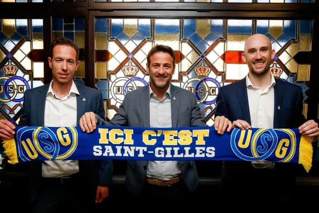 USG's Chris O'Loughlin (left). (NICOLAS MAETERLINCK/AFP via Getty Images)