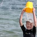 Max Halliwell cools down in the sea at Helens Bay. Photograph by Declan Roughan / Press Eye