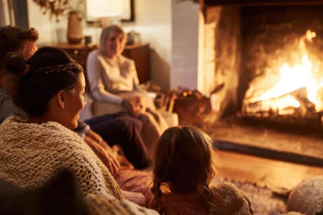 Family Gathered Around Fireplace in Cozy Living Room