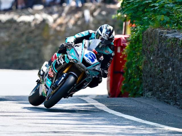 Michael Dunlop set the fastest Supersport lap of qualifying so far at the Isle of Man TT after switching back to his MD Racing Yamaha
