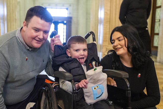 Six-year-old Daithi Mac Gabhann and his parents Mairtin Mac Gabhann (left) and mother Seph Ni Mheallain (right) at Parliament Buildings at Stormont, ahead of a recalled sitting of the Assembly focused on a stalled organ donation law.