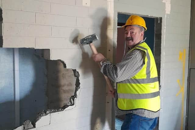 South Armagh man Ian Bothwell, seen here demolishing the internal walls of his local bank in Crossmglen.