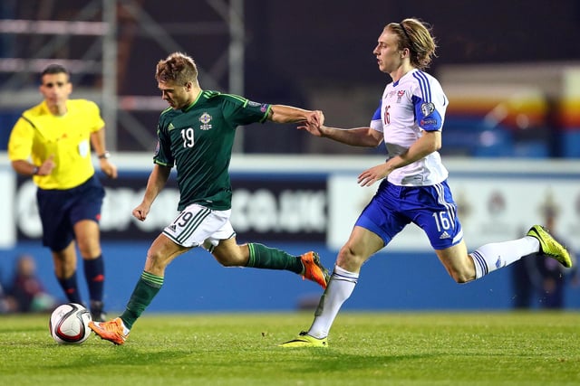 Northern Ireland's Jamie Ward takes on Faroe Islands' Jóan Edmundsson. The 37-year-old is playing for Southern League Premier Division Central side Nuneaton Borough in England, joining the club this summer after a spell as player-manager at Ilkeston Town