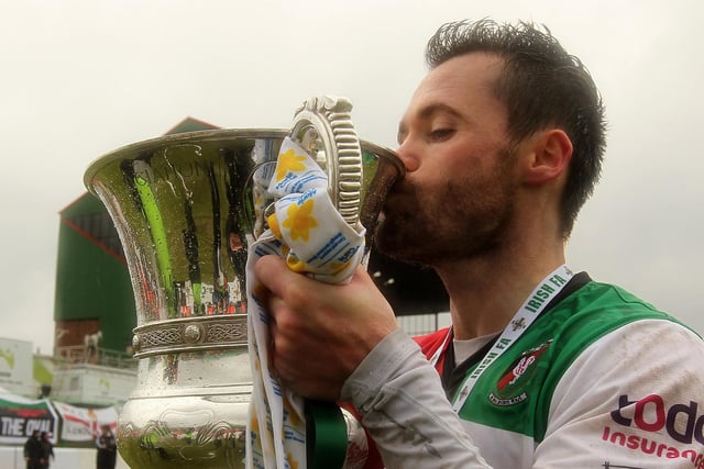 David Scullion celebrates with the Irish Cup trophy after scoring the only goal in Glentoran's 1-0 2014/15 triumph over Portadown