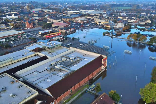 The River Bann has bust its banks in Portadown, with Meadow Lane shopping area closed to traffic. Photo: Paul Cranston www.blackboxaerialphotography.com