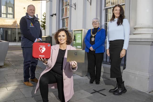 Hugh Black, Ballymena BID Board member, is pictured with Sinead Connolly, alongside Deputy Mayor Beth Adger MBE and Clare Moore, Ballymena BID, with the new defib