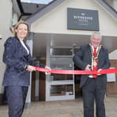 Causeway Coast and Glens Council Mayor Cllr Ivor Wallace has the honour of cutting the ribbon at the official opening of the Riverside Hotel Coleraine pictured with Karen Yates CEO Causeway Chamber of Commerce along with Rajesh Rana, director of the Andras House Hotel Group