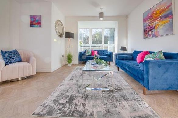 The living room is a lovely space that invites you to make your own mark. Sizeable and full of natural light, it lends itself to comfort and relaxation.,