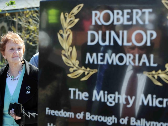 PACEMAKER, BELFAST, 8/5/ 2010: A mother's tears.
May Dunlop reads the inscriptions on her son Robert's memorial on the day it was unveiled in the Robert Dunlop Memorial Garden in Ballymoney during 2010.
PICTURE BY STEPHEN DAVISON:-