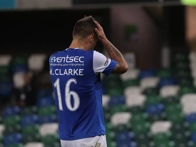 Linfield's Matthew Clarke looks dejected after missing his penalty during the shootout of the UEFA Europa Conference League play-off match at Windsor Park, Belfast. Photo credit: Liam McBurney/PA Wire.