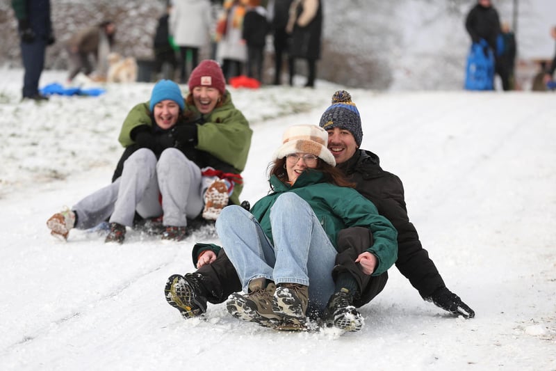 Kate Ramsey, Aisling Doherty, Therese Forester and Pablo O’Connor sleighing down the Brooke Park embankment.Photo Lorcan Doherty
