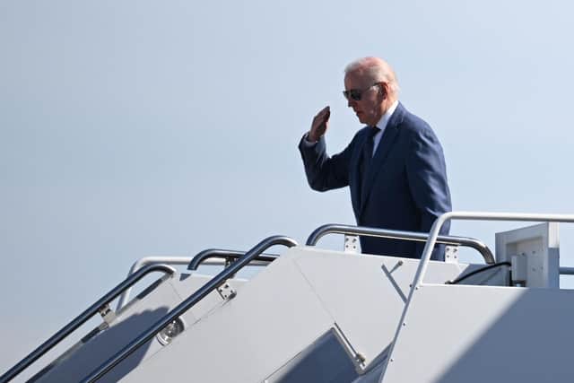 US President Joe Biden salutes before boarding Air Force One, as he departs for Northern Ireland, at Joint Base Andrews in Maryland on April 11, 2023. (Photo by Mandel NGAN / AFP) (Photo by MANDEL NGAN/AFP via Getty Images)