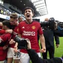 Manchester United's Bruno Fernandes (second left) celebrates with team-mates after scoring the winning goal against Fulham at Craven Cottage. (Photo by Kieran Cleeves/PA Wire)