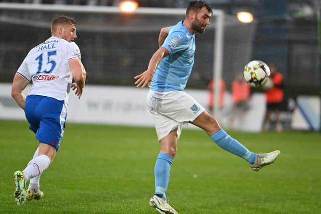 Ballymena United striker Johnny McMurray (right) will be aiming to shoot down Glentoran this evening