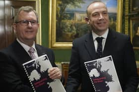 Northern Ireland Secretary Chris Heaton-Harris and DUP leader Sir Jeffery Donaldson at Hillsborough Castle hold the agreement, called ‘Safeguarding the Union’ on January 31. Photo: Niall Carson/PA Wire