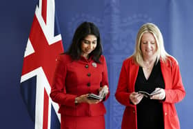 Home Secretary Suella Braverman and Abi Tierney, Director General of HM Passport Office and UK Visas and Immigration with the new King Charles III UK passport, at the Home Office, central London