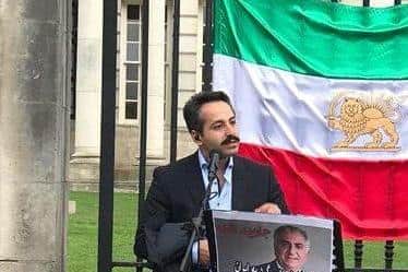 Hamid Savar pictured protesting for political change in his home country of Iran, in front of Belfast City Hall last year
