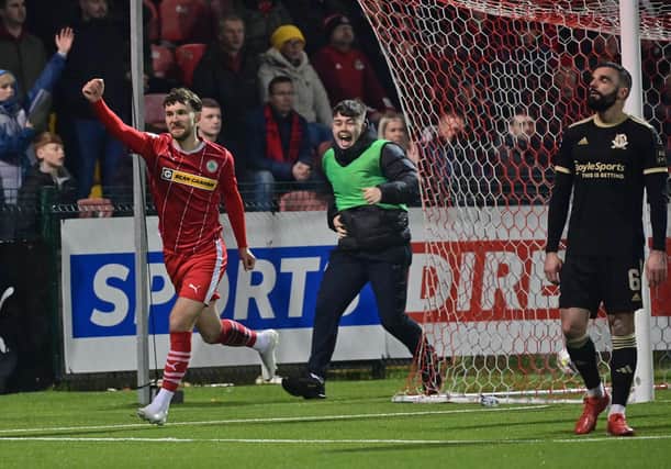 Ben Wilson (left) celebrates scoring the decisive goal for Cliftonville against Crusaders in the Sports Direct Premiership. (Photo by Colm Lenaghan/Pacemaker)