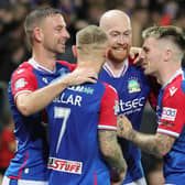 Chris Shields celebrates with his Linfield team-mates after netting in the derby day clash against Glentoran at Windsor Park