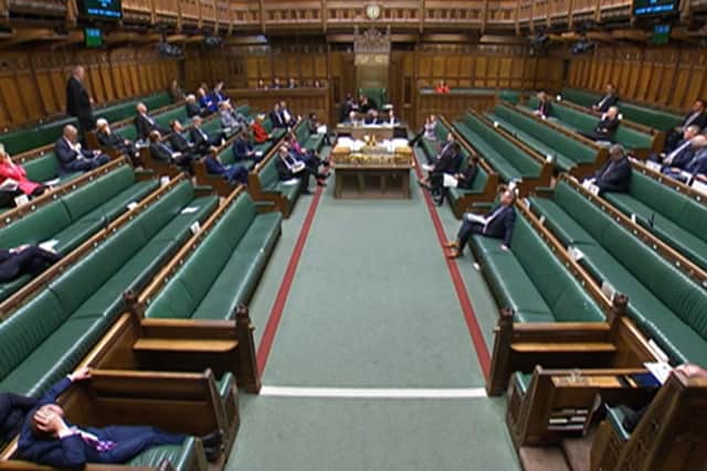 A video grab from footage broadcast by the UK Parliament's Parliamentary Recording Unit (PRU) shows MPs attending a debate ahead of a vote on a motion to approve the draft Windsor Framework. Photo by -/PRU/AFP via Getty Images
