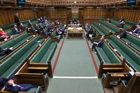 A video grab from footage broadcast by the UK Parliament's Parliamentary Recording Unit (PRU) shows MPs attending a debate ahead of a vote on a motion to approve the draft Windsor Framework. Photo by -/PRU/AFP via Getty Images