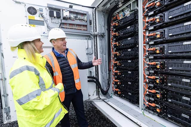 Hillsborough construction firm, Graham supports NI Water’s ambitious sustainability goals with completion of £6.9m battery energy storage system in south Antrim. Pictured are  Dr Sara Venning, CEO NI Water with Gordon Nixon, Scotts Electrical Services Ltd