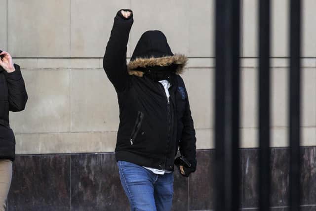 James Smyth celebrates as he leaves Belfast Crown Court after he was found not gully of the murders of Catholic workmen Eamon Fox and Gary Convie in 1994 as well as one count of attempted murder, possession of a firearm and membership of a proscribed organisation, the UVF. Pic: Liam McBurney/PA Wire