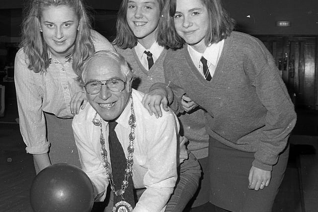 Castlereagh Mayor Ernest Anderson gets some cross-border advice on bowling in February 1992 from Mairead O’Grady from Cork and Sharon Meaney and Donna Young from Knockbreda High School during their joint day out at Dundonald Icebowl as part of an Organisation for Economic Cooperation and Development project. Picture: News Letter archives