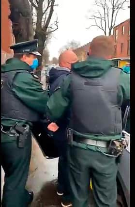 Police arrest a man at the Sean Graham anniversary event in 2021 on the Ormeau Road. If a political party got a prisoner released outside of due process, it is a major constitutional and legal issue