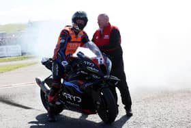 Storm Stacey is congratulated by North West 200 Event Director Mervyn Whyte on his maiden victory at the event in May. (Photo by Stephen Davison/Pacemaker Press)
