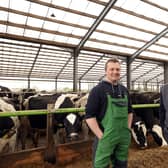 Dairy farmer George Bingham talks with Chris Chambers of Brett Martin about the positive impact of the new roofing on his herd. They are pictured on the Bingham dairy farm in County Antrim