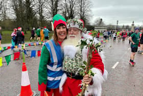 Race director Marianne Hood and Jimmy McNeilly dressed as Santa at the festive-themed Christmas Day Parkrun around Stormont in Belfast. (Photo by PA Wire)