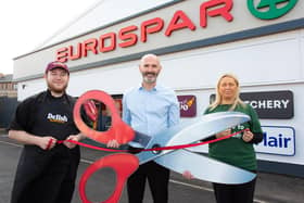 Store manager Conor Finnegan (centre) is pictured with Food To Go manager Kyle McLoughlin  and community rep Beata Smyth at the official reopening of Eurospar Lurgan on the Gilpinstown Road
