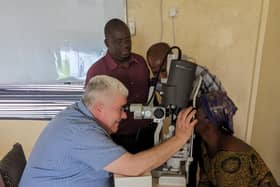 Prof Colin Willoughby treating patients in Sierra Leone