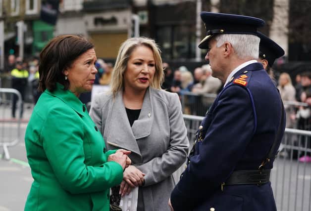 Sinn Fein Party leader Mary Lou McDonald (left) and vice president Michelle O'Neill speaking with members of An Garda Siochana following a ceremony at the GPO on O'Connell Street in Dublin to mark the anniversary of the 1916 Easter Rising yesterday. Photo: Brian Lawless/PA Wire