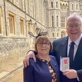 Rev Mervyn Gibson and wife Lynda following his MBE presentation at Windsor Castle