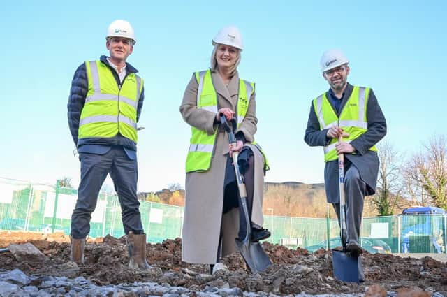 Housing Executive Chief Executive Grainia Long (centre) is joined on-site by Damian Murray (left), from GEDA Construction and Paul Price (right) Director of Housing at the Department for Communities at Sunningdale Gardens in north Belfast. Photo: Simon Graham