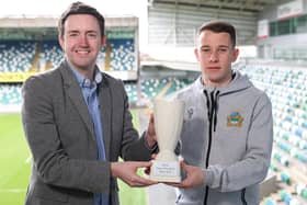 NIFWA Chairman Michael Clarke presents Linfield's Kyle McClean with the Dream Spanish Homes Player of the Month trophy for March