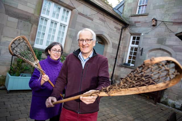 Moira O’Rourke (Cultural Heritage Officer at Ards and North Down Borough Council) and Robin Masefield (local historian) with lacrosse sticks dating from 1938. Mr Masefield is working with Ards Historical Society to collate an exhibition which will highlight the rise of lacrosse in the late 19th century in Ards. Picture: Graham Baalham-Curry.