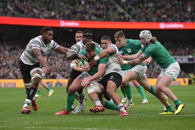 Stuart McCloskey of Ireland is tackled just short of the try line during the Autumn International match between Ireland and Fiji at Aviva Stadium on November 12, 2022 in Dublin, Dublin. (Photo by Charles McQuillan/Getty Images)