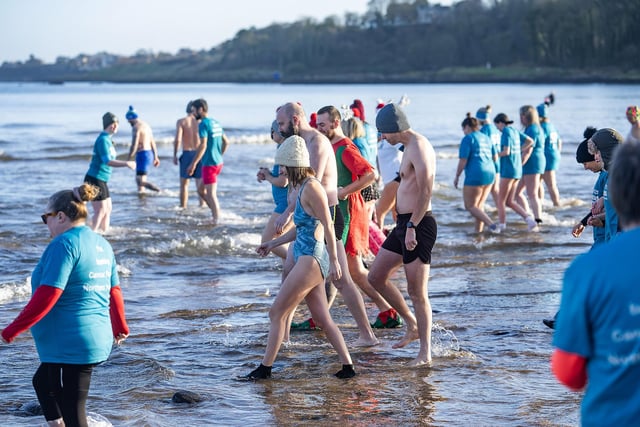 250 swimmers, dippers, and splashers have gathered at Crawfordsburn Beach in Co Down for Cancer Focus NI’s annual ‘Dare to Dip’ swim.