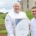 Executive chef Stephen Holland and executive sous chef Adam Milliken celebrate the award