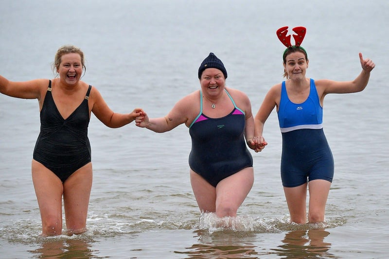 Some of the swimmers who took part in the annual Christmas morning charity swim at Ludden beech