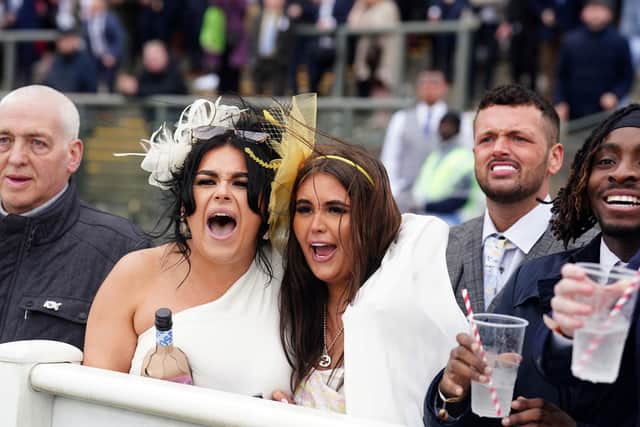 Racegoers at the 2024 Randox Grand National Festival at Aintree Racecourse, Liverpool on Saturday. The main race had the "most wonderful finish" said the Ulster jockey great AP McCoy. Photo: Mike Egerton/PA Wire