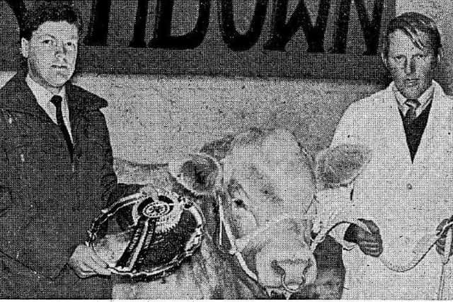 Pictured from Farming Life March 1983 - Desmond Cummings, of Omagh, winner of the supreme championship. Mr Cummings received the Northern Bank Perpetual Challenge Trophy from Malcolm McNeely, of the bank's agricultural department. Picture: Farming Life archives/Darryl Armitage